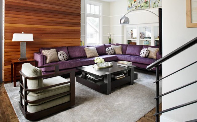 l-shaped-purple-sofa-and-wood-accent-wall-for-a-beautiful-living-room